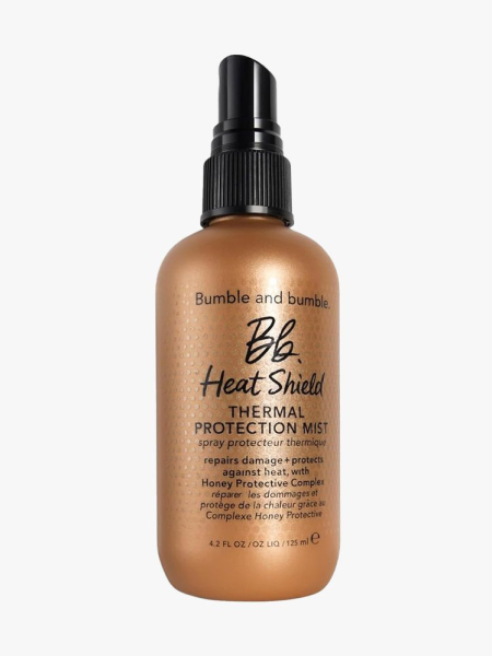 Bumble and bumble Heat Shield Thermal Protection Hair Mist gold spray bottle on light gray background